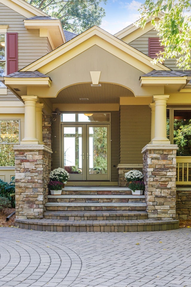 view of exterior entry featuring french doors