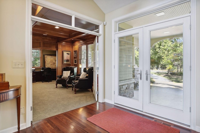 doorway featuring french doors, dark hardwood / wood-style floors, and vaulted ceiling