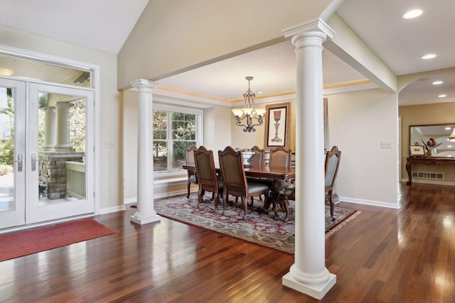 dining room featuring french doors, a notable chandelier, ornamental molding, and dark hardwood / wood-style flooring