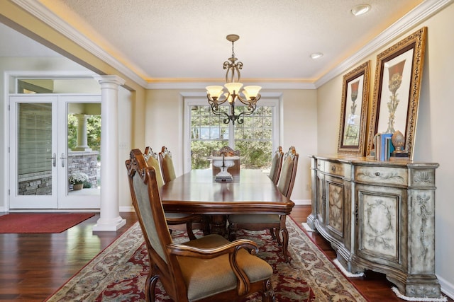 dining area featuring french doors, a textured ceiling, and dark hardwood / wood-style floors