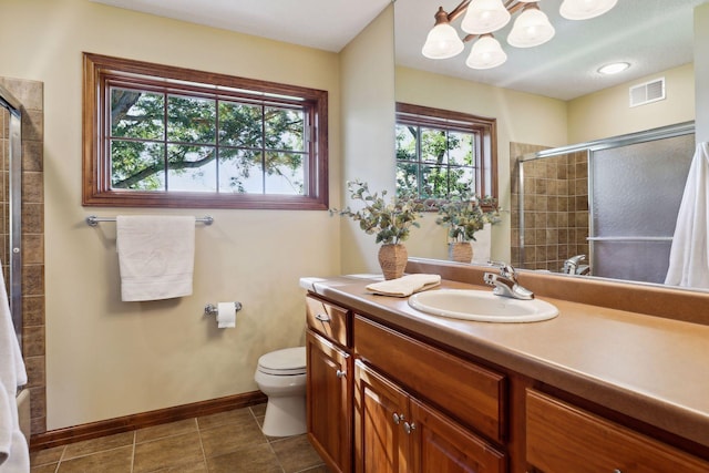 bathroom with vanity, toilet, and walk in shower