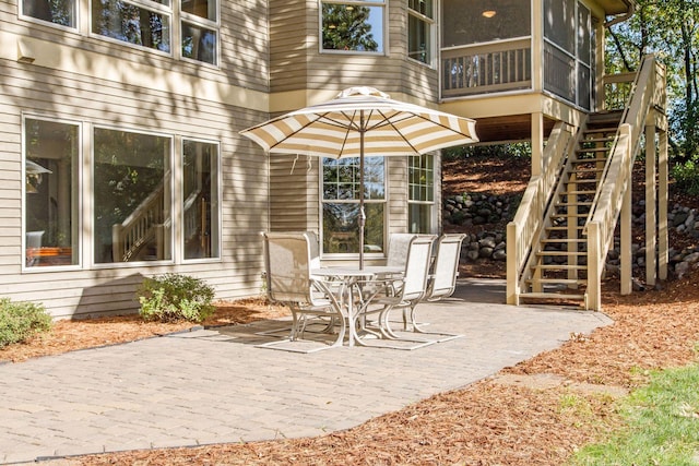 view of patio with a sunroom