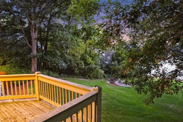 deck at dusk with a yard