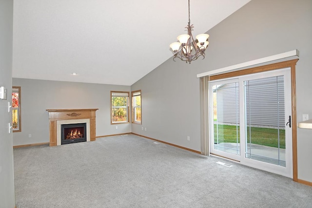 unfurnished living room featuring a warm lit fireplace, carpet, baseboards, and an inviting chandelier