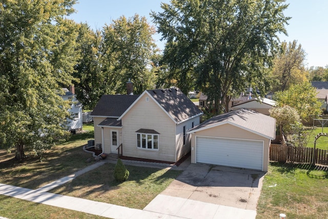 bungalow with fence, concrete driveway, a front lawn, and a garage