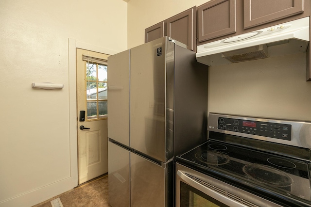 kitchen featuring under cabinet range hood and stainless steel appliances
