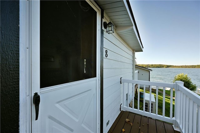 exterior space with a water view and a balcony