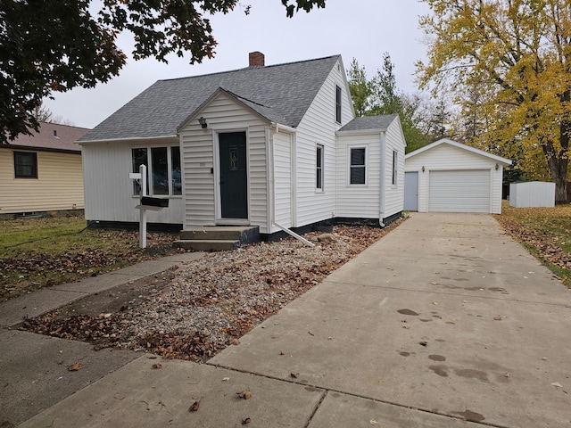 view of front facade with an outbuilding and a garage