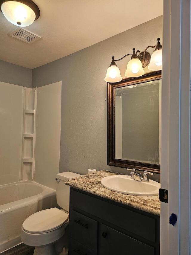 full bathroom featuring vanity, toilet, and washtub / shower combination