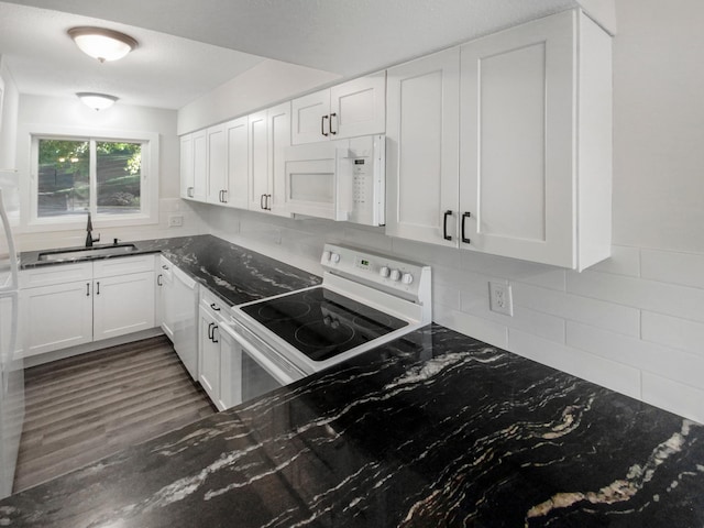 kitchen with white cabinetry, tasteful backsplash, white appliances, dark hardwood / wood-style floors, and sink