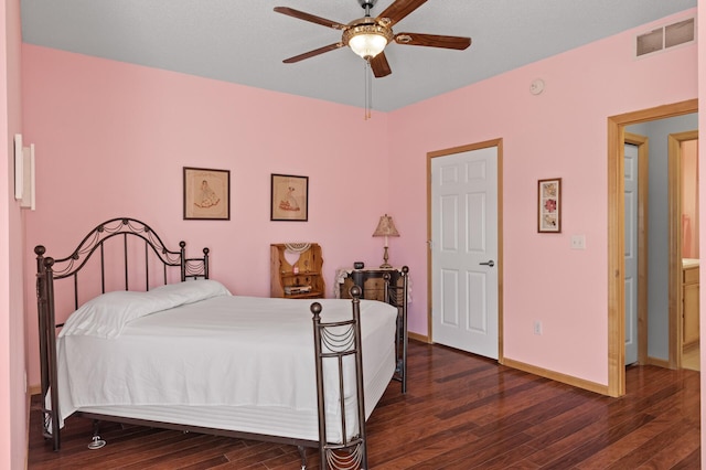 bedroom with dark wood-type flooring and ceiling fan