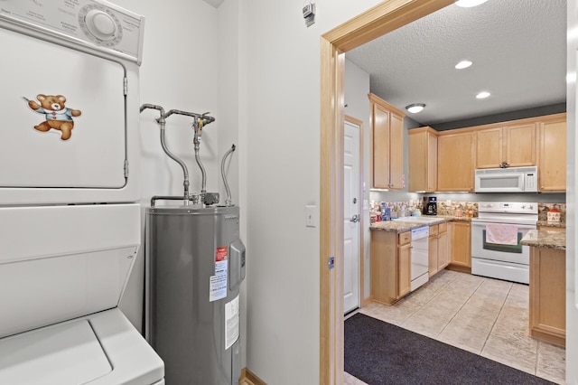 kitchen featuring light stone counters, a textured ceiling, white appliances, water heater, and light brown cabinetry