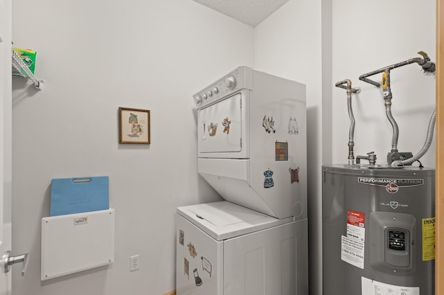 laundry area with stacked washer / dryer, a textured ceiling, and electric water heater