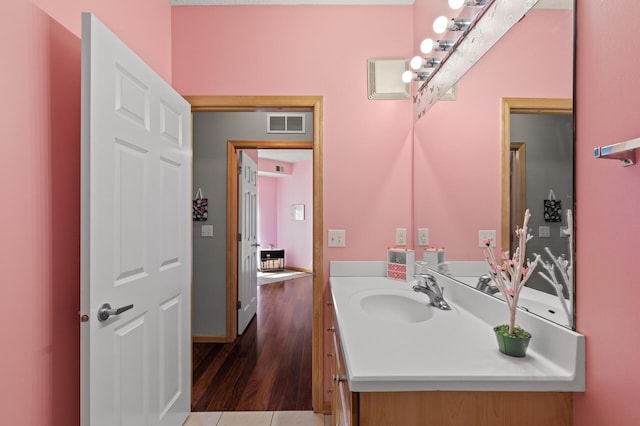 bathroom with wood-type flooring and vanity