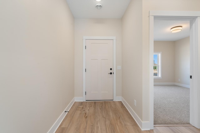 doorway to outside featuring light hardwood / wood-style floors