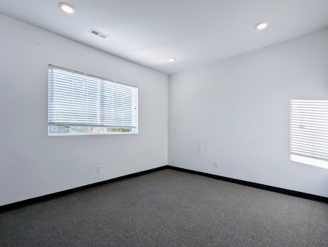 empty room featuring carpet flooring