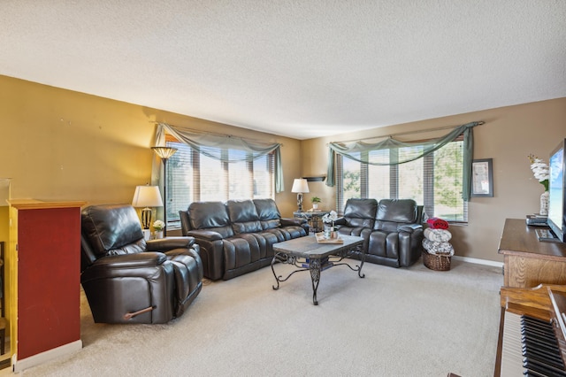 living room featuring a textured ceiling and carpet floors