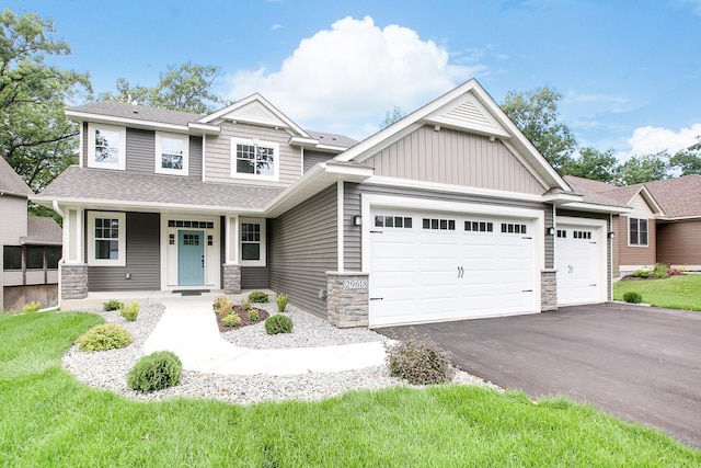 craftsman-style house with stone siding, a garage, driveway, a shingled roof, and a porch