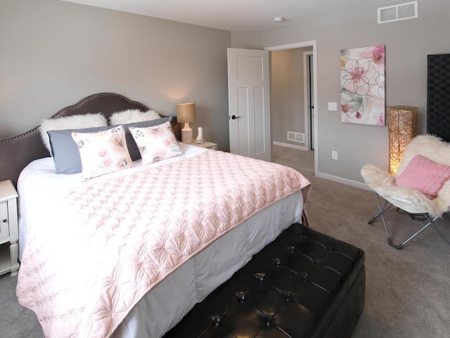 bedroom with carpet floors, baseboards, and visible vents