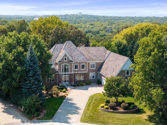 exterior space with a garage, a front yard, and covered porch