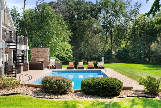 view of swimming pool with a yard, a patio area, and a deck