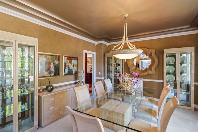 dining area featuring ornamental molding