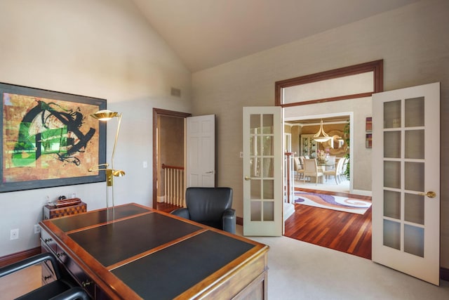 office featuring french doors, high vaulted ceiling, and carpet flooring