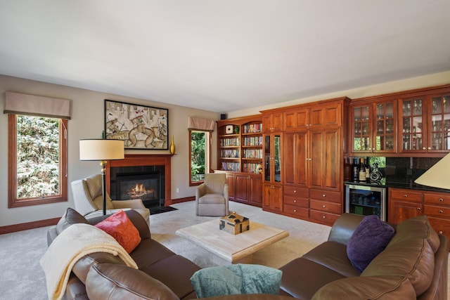 living room featuring wine cooler, indoor bar, and light colored carpet