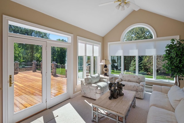 sunroom with ceiling fan and lofted ceiling