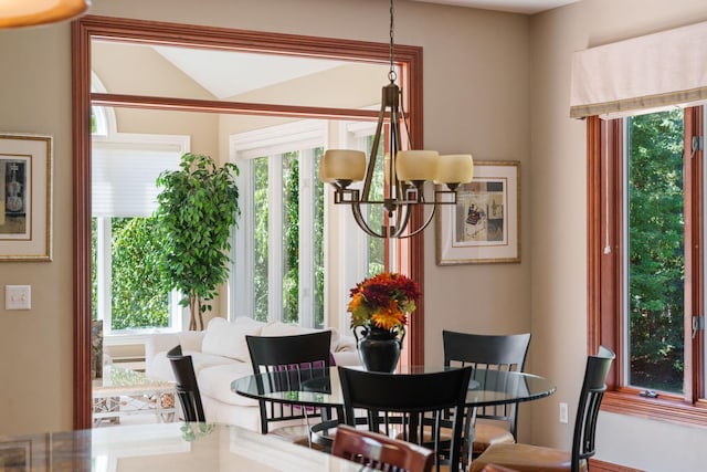 dining area with a chandelier and a healthy amount of sunlight