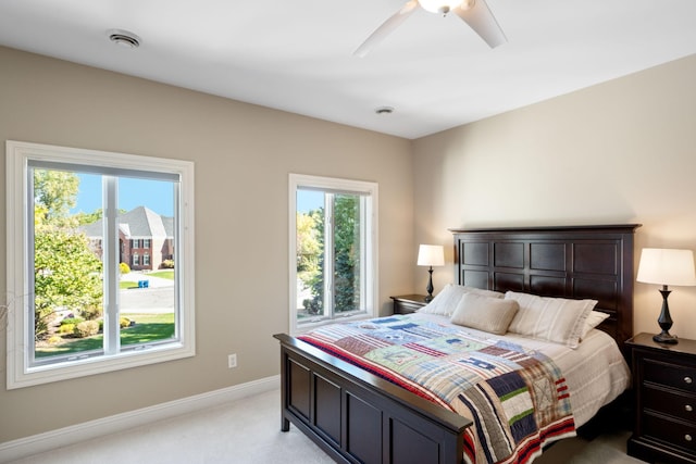 bedroom featuring light carpet and ceiling fan