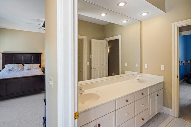 bathroom featuring ceiling fan, vanity, and tile patterned floors