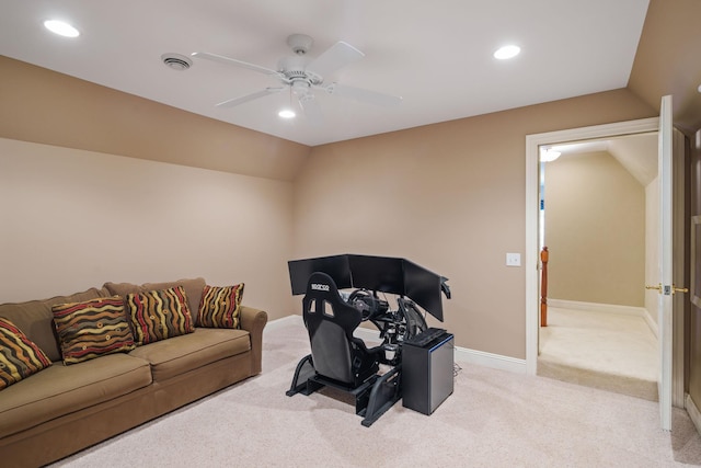 living room featuring light carpet, ceiling fan, and vaulted ceiling