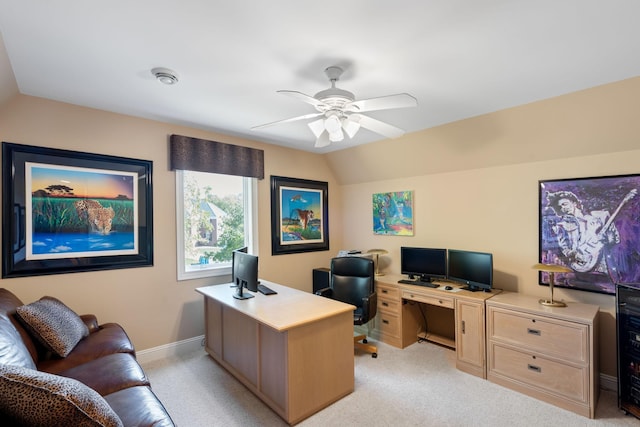 carpeted office featuring ceiling fan and vaulted ceiling