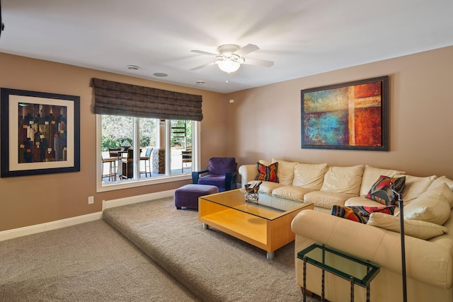 carpeted living room featuring ceiling fan