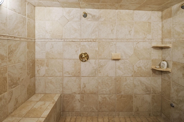 interior space featuring tiled shower