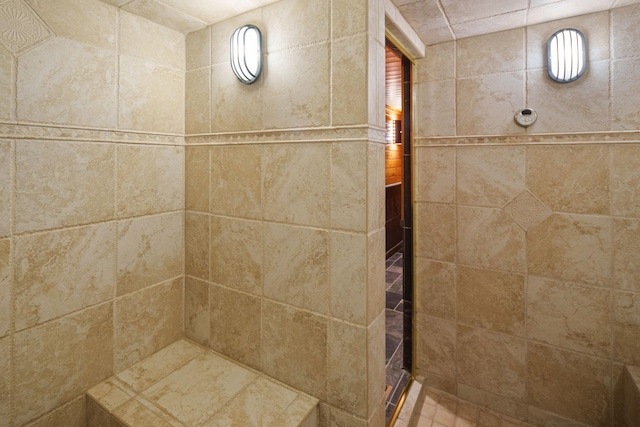 bathroom with a tile shower