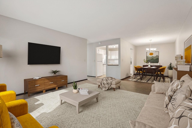 living room featuring an inviting chandelier and light colored carpet