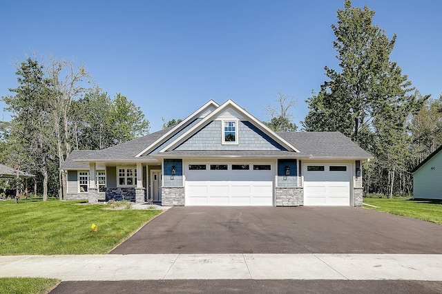 craftsman-style home with a garage and a front yard