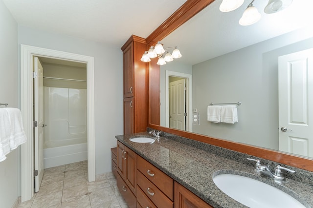 bathroom featuring vanity, bathing tub / shower combination, and tile patterned flooring