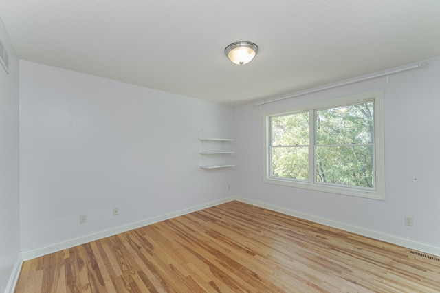 empty room with light wood-type flooring