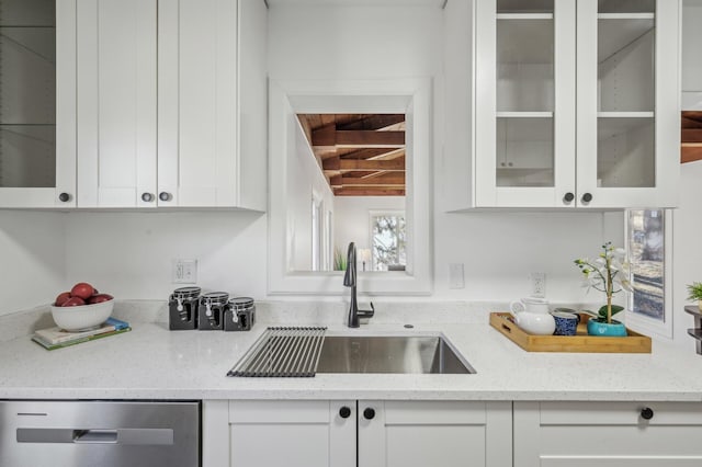 bar with sink, dishwasher, and white cabinets