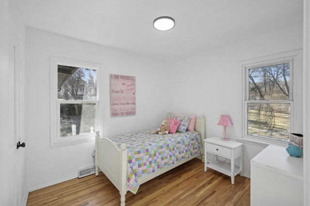 bedroom featuring light wood-type flooring