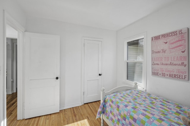 bedroom with light hardwood / wood-style flooring