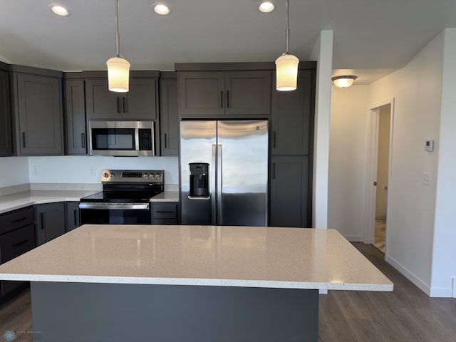 7007 Benji Ln, Fargo, ND 58047 - kitchen with appliances with stainless steel finishes, light stone countertops, recessed lighting, dark wood-type flooring, and gray cabinets