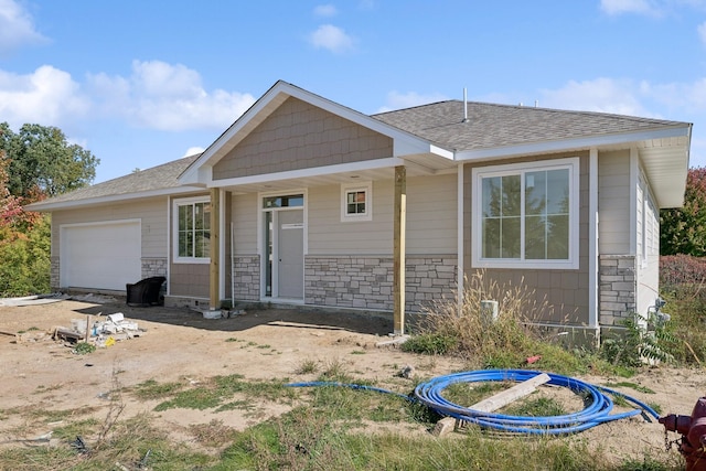 ranch-style house featuring a garage