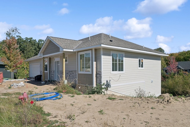 view of property exterior with a garage