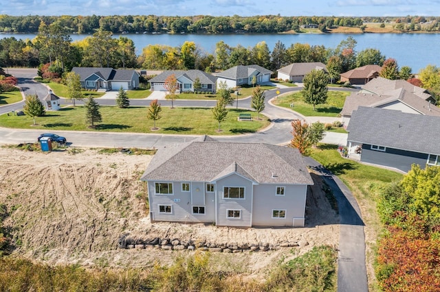 birds eye view of property featuring a water view