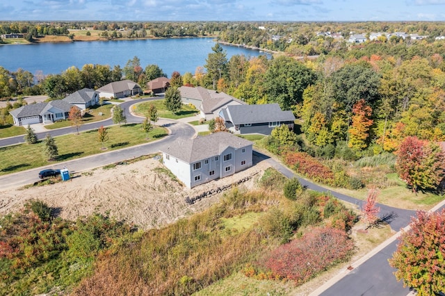 birds eye view of property with a water view