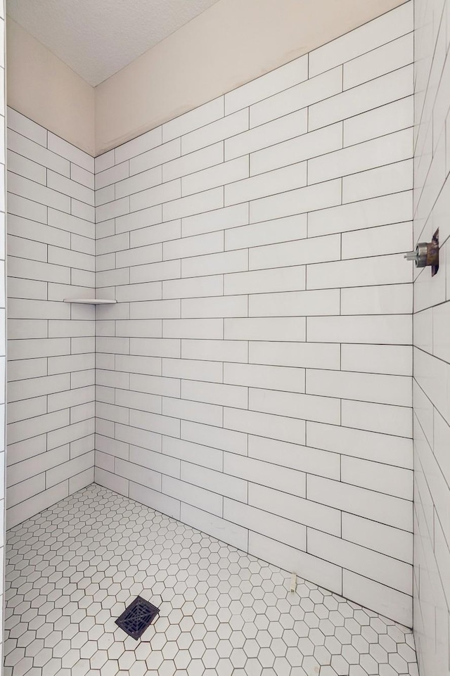 bathroom with a tile shower